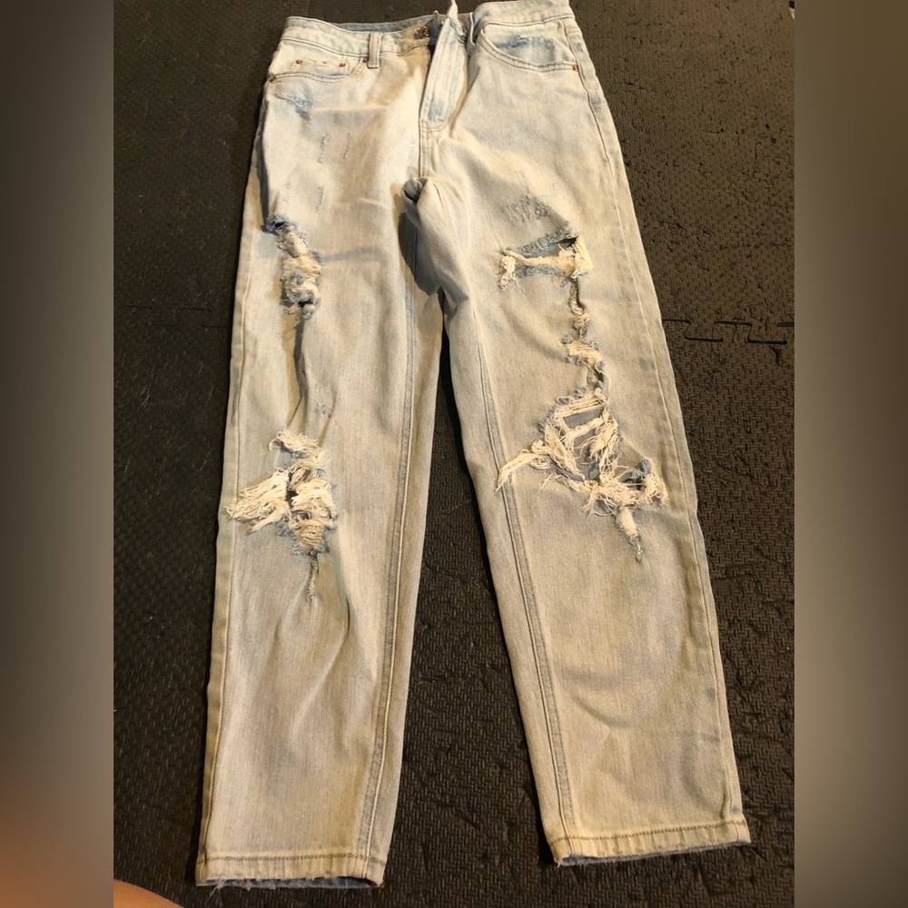 Denim pants with distress and holes